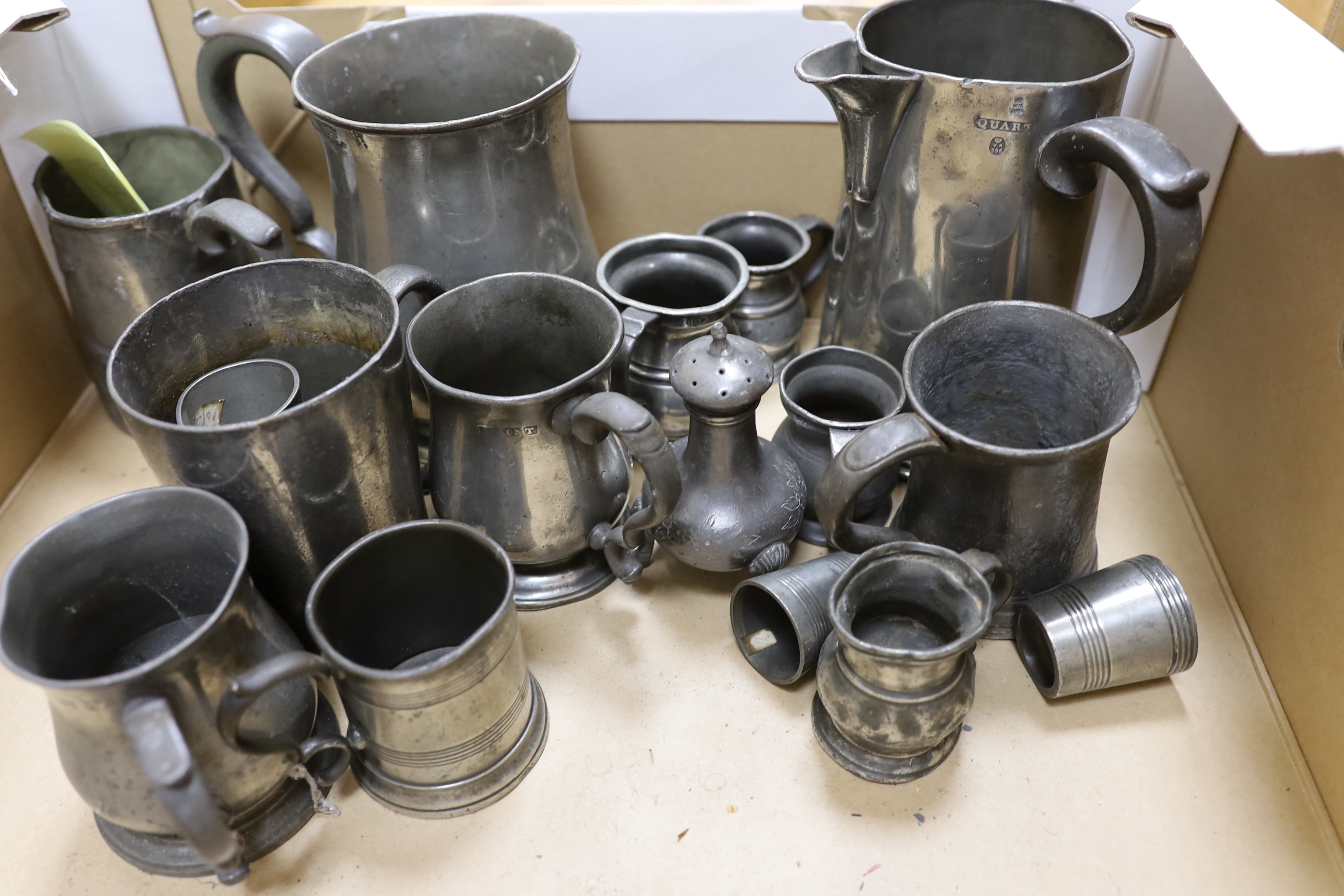 A collection of pewter mugs and measures including, The New Green Man Pub, Watford 1730, The Two Brewers, St Albans 1792 and The Lower Red Lion St Albans 1767, j tallest item 17cm high